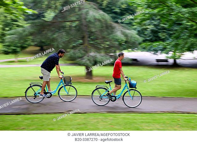 Group of tourists doing a tourist tour by bicycle, Parque de Doña Casilda de Iturrizar, Bilbao, Bizkaia, Basque Country, Spain, Europe