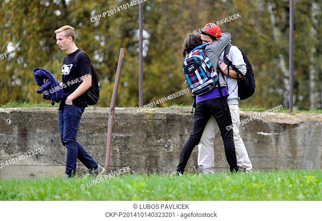 Students reacts near their high school where a woman stabbed and killed a teenager and injured two other students in Zdar nad Sazavou