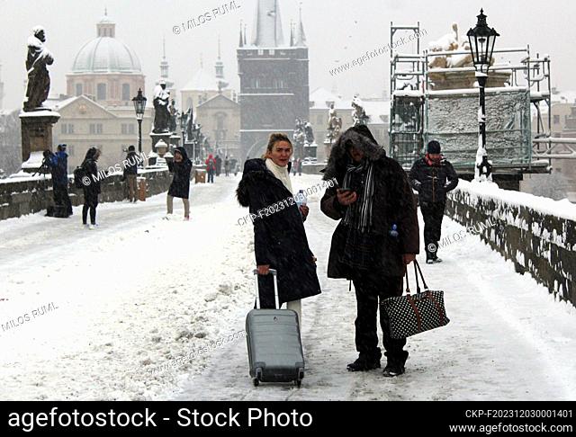 Tourists walking in the Charles Bridge in winter, Prague, Czech Republic, December 2, 2023. (CTK Photo/Milos Ruml)