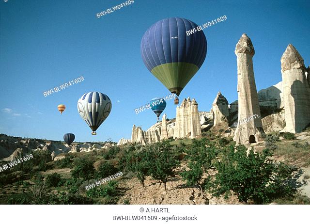 hot-air ballons over tuff rocks in Cappadocia