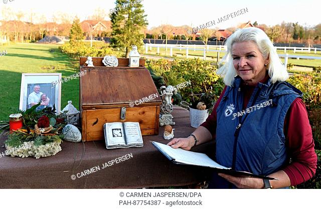 Carmen Hanken, the widow of Tamme Hanken, stands with a condolence book for her husband at Hankenhof - Tamme in Filsum, Germany, 02 February 2017