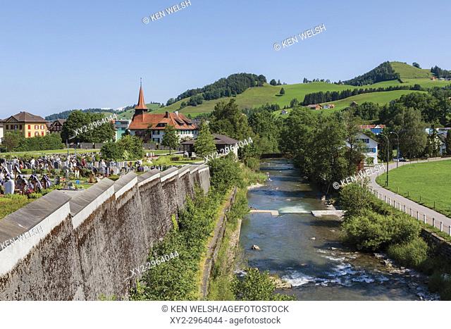 Appenzell, Appenzell Innerrhoden Canton, Switzerland. The Sitter River flowing through the town. Countryside beyond