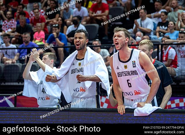 03 July 2021, Croatia, Split: Basketball: Olympic qualifying, Germany - Croatia, knockout round, semi-final. Germany's Johannes Thiemann and Jan Niklas Wimberg...