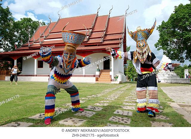 People dressed up with ghost masks and colourful costume. Phi Ta Khon masks Festival, which is annually held in the 7th lunar month (June)