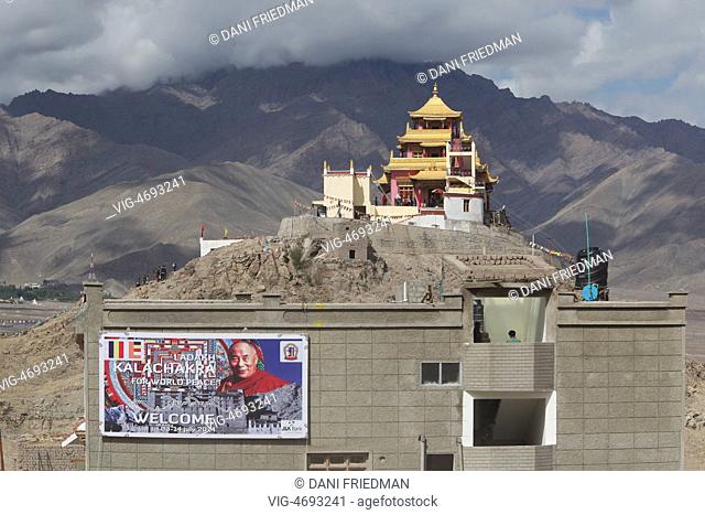 INDIA, CHOGLAMSAR, 03.07.2014, Image of His Holiness the 14th Dalai Lama on a banner advertising the 33rd Kalachakra Pooja in the small Himalayan village of...