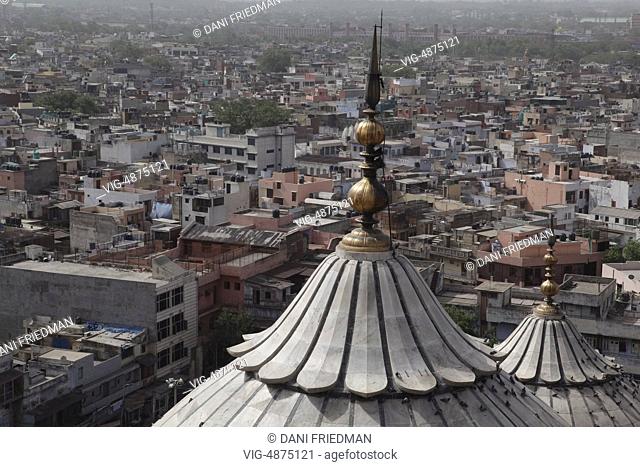 The domed roofs of the Jamia Masjid (Jama Masjid) tower over the city of Old Delhi, Delhi, India. The Jamia Masjid is the principal mosque of Old Delhi and was...