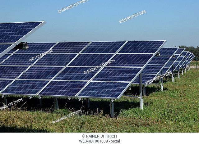 Germany, Bavaria, Solar panels on grass against sky