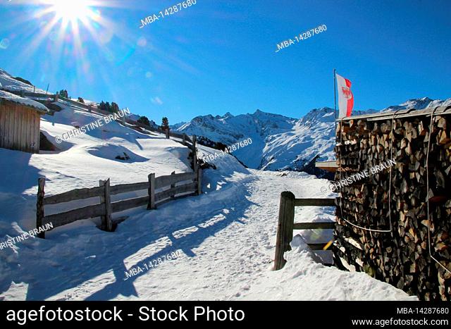 Winter hike to Juifen Alm 2022m in Sellraintal, Austria, Tyrol, vacation, winter, hiking trail, sun, fence, flag