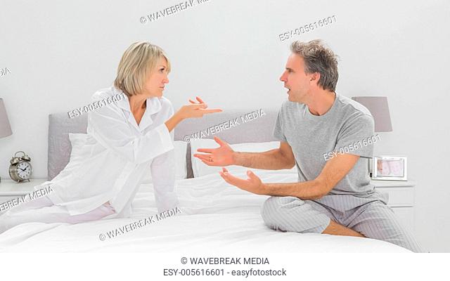 Couple arguing in bedroom