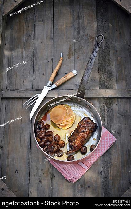 Leg of beaver with caramelised chestnuts, pancakes and maple syrup
