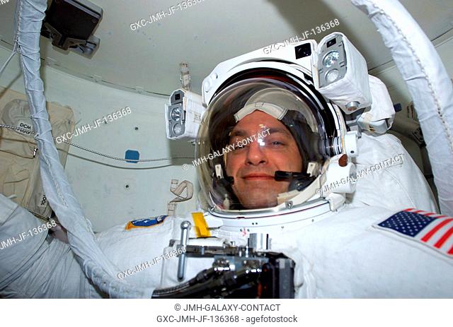 Astronaut Richard M. Linnehan, mission specialist, has just completed donning his extravehicular mobility unit (EMU) space suit for the second bonafide time...
