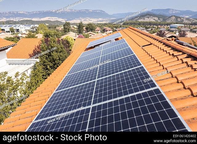 Solar panels on a roof. Drone view. Navarre, Spain, Europe. Environment and technology concepts