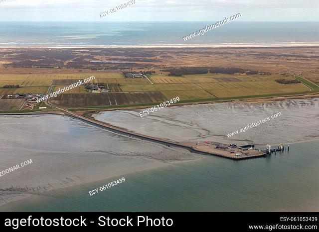 Aerial view Dutch island Schiermonnikoog with pier ferry terminal at low tide