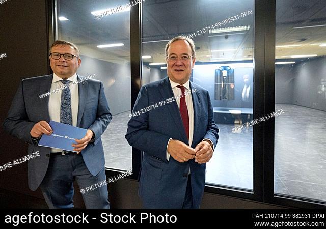 14 July 2021, Baden-Wuerttemberg, Stuttgart: Armin Laschet (r), Minister President of North Rhine-Westphalia, Federal Chairman of the CDU and candidate for...