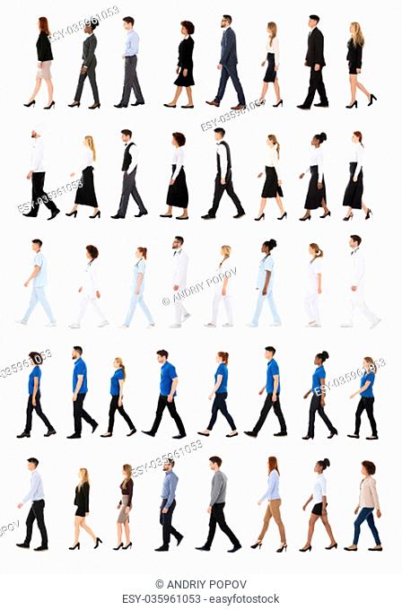 Multiracial Businesspeople Walking In Row Against White Background