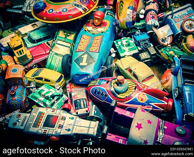 lots of vintage toys on a wooden floor