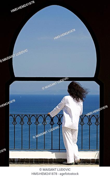 Morocco, Tangier Tetouan Region, Tangier, Kasbah, Nord-Pinus Tanger Hotel, lady client sitting at the terrace facing the Strait of Gibraltar