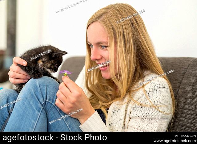 Young woman with kitten