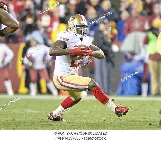San Francisco 49ers running back Frank Gore carries the ball in fourth quarter action against the Washington Redskins at the FedEx Field in Landover, USA