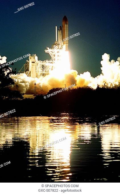 02/07/2001 -- Rising from clouds of smoke and steam, Space Shuttle Atlantis rushes into the night sky as it lifts off from Launch Pad 39A