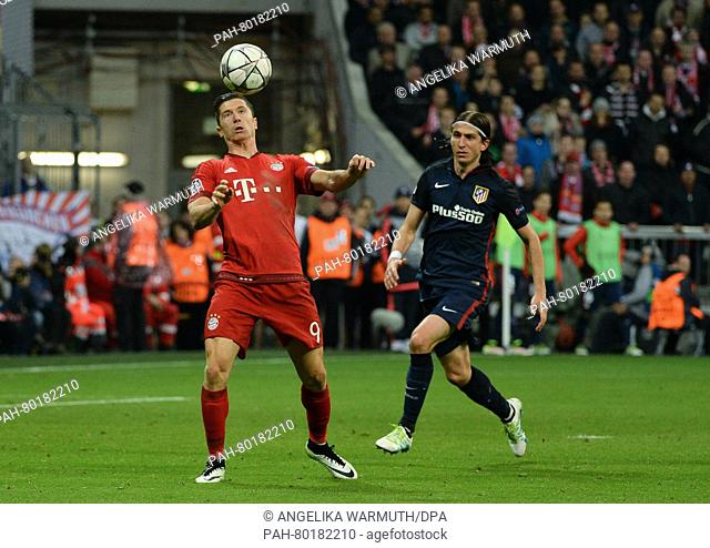 Munich's Robert Lewandowski (L) in action against Madrid's Filipe Luis during the UEFA Champions League semi final second leg soccer match between Bayern Munich...