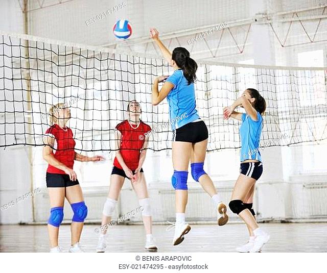 girls playing volleyball indoor game