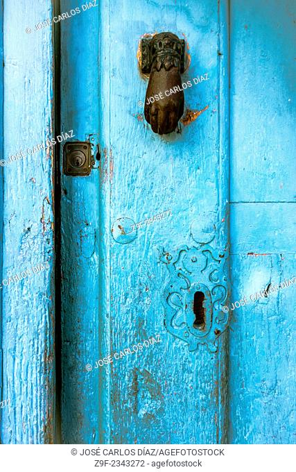 Knocker and locks of a house in Sepulveda, Segovia province, Castilla-Leon, Spain