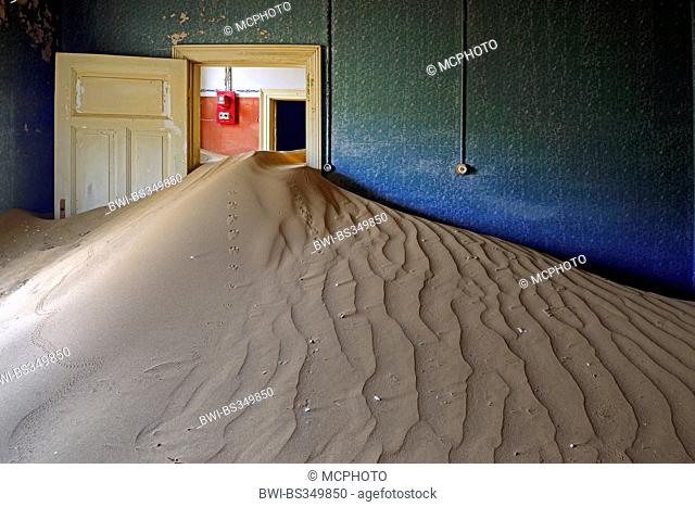 house taken from dunes and desert sand, buidling of the former village Kolmanskop at a diamond mine, Namibia, Kolmanskop