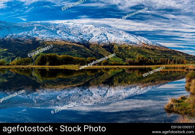 Snow mountains and reflection on lake in South Island, New Zealand