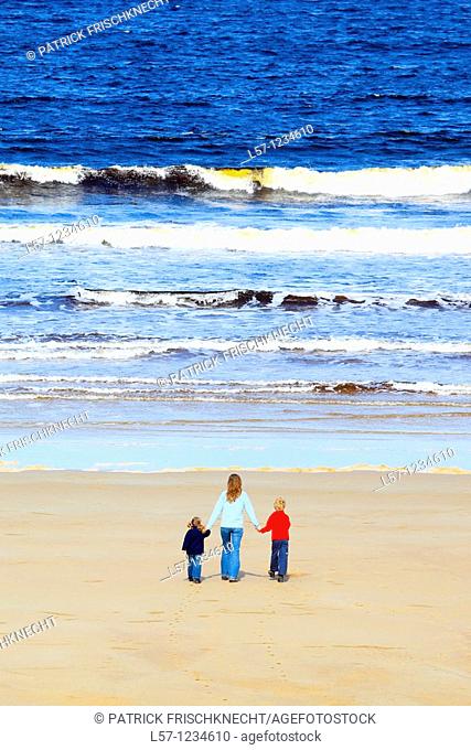 family on sandy beach, Sutherland, Scotland