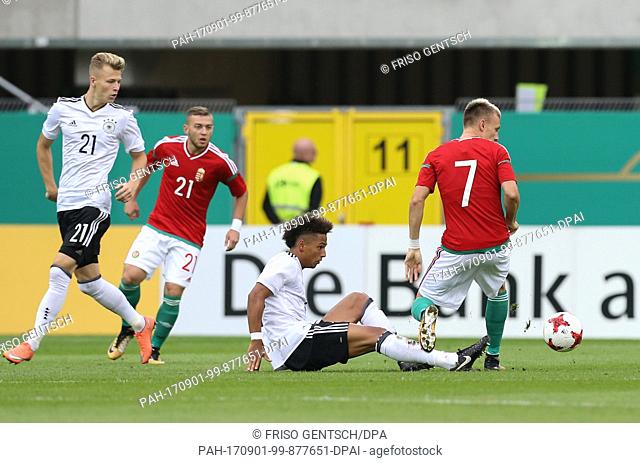 Germany's Thilo Kehrer (2-r) and Hungary's Gabor Makrai (R) vie for the ball, Tim Starke (L) and Donat Zsoter (2-L) watch it during the Under 21 test match...