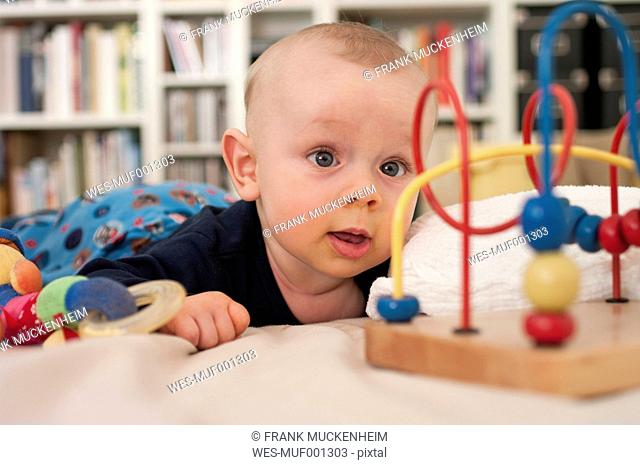 Germany, Hesse, Frankfurt, Baby boy playing with toy
