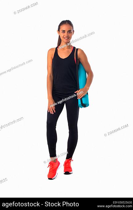 Healthy hispanic fitness girl with rolled gymnastics yoga mat isolated on white background