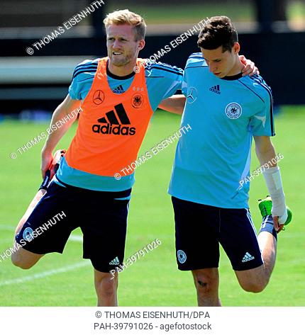 Andre Schürrle (L) and Julian Draxler are pictured during the training of the German national team on the grounds of the Barry University in Miami, USA