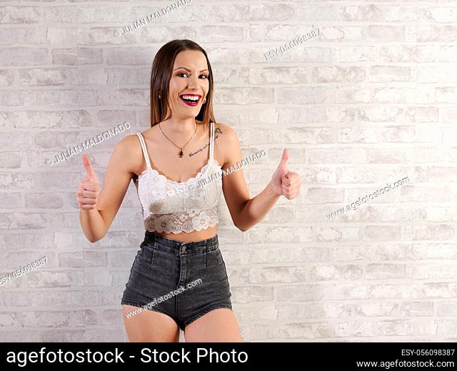 Beautiful young woman wearing casual clothes and positive fitness
