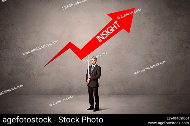 Young business person in casual holding road sign with INSIGHT inscription, business direction concept