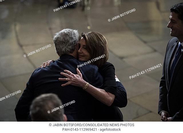 WASHINGTON, DC - DECEMBER 3 : Outgoing Speaker Paul D. Ryan and Nancy Pelosi greet former president George W. Bush after paying their respects to former...