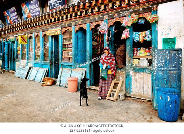 Traditional wooden shop fronts in Thimpu, Bhutan. Digitally Manipulated Image. Stylised by enhancing color, sharpening and adding texture