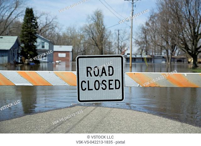 Close up of information sign at the end of flooded street
