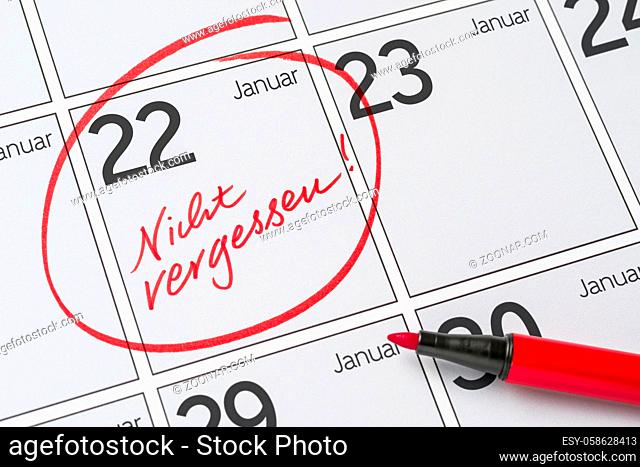 Save the Date written on a calendar - January 22 - Nicht vergessen in german