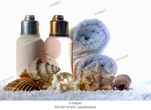 Accessories for a bath with cockleshells on a white background
