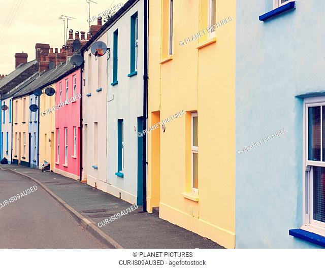 Colourful houses in street, where Dylan Thomas lived and worked, Laugharne, Camarthenshire, Wales