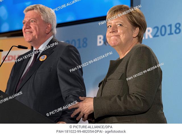 22 October 2018, Hessen, Ortenberg: Chancellor Angela Merkel (CDU) is standing in the marquee on the Cold Market next to Hessian Prime Minister Volker Bouffier
