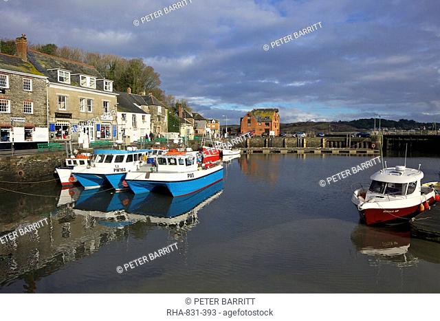 Winter sunshine on fishing boats in Padstow harbour, Cornwall, England, United Kingdom, Europe