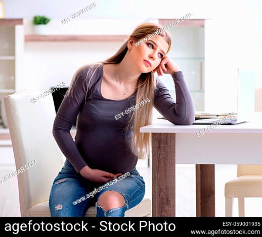 The pregnant woman at home getting ready for childbirth