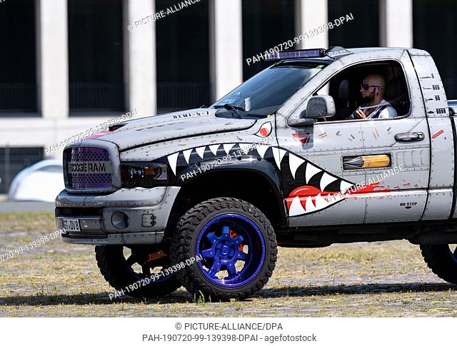 20 July 2019, Lower Saxony, Hanover: A conspicuous Dodge RAM drives across the grounds during the Street Mag Show in Hanover