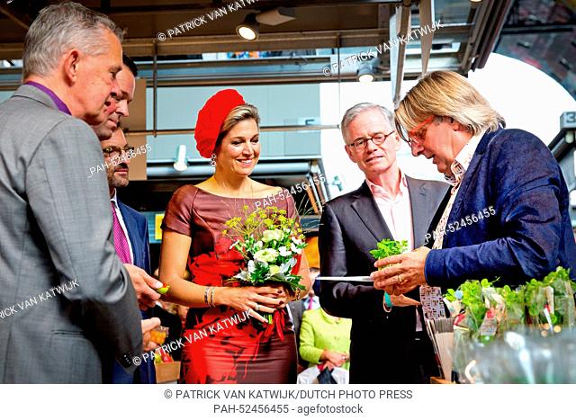 Queen Maxima (wearing red and a red hat) of The Netherlands opens the Markthal in Rotterdam, The Netherlands, 1 October 2014