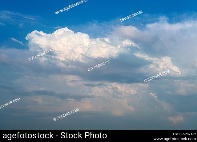 White cumulus clouds in blue sky background