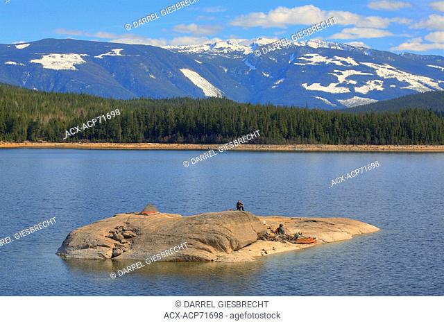 a canoer setting up camp on his own island on Watchan Lake, British Columbia, Canada, Darrel Giesbrecht