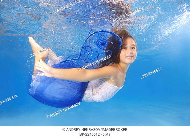 Girl presenting underwater fashion in pool, Odessa, Ukraine, Eastern Europe